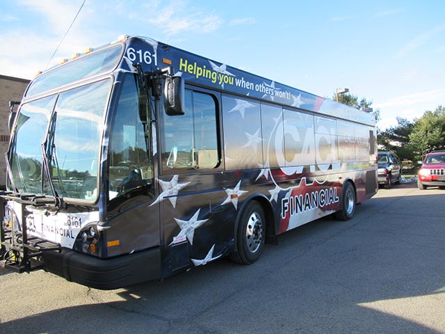 An STS bus parked in front of a building.