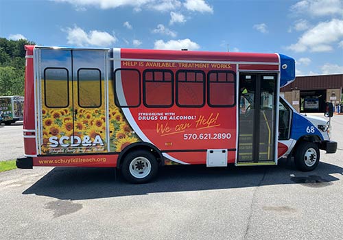 An STS vehicle with an advertisement.